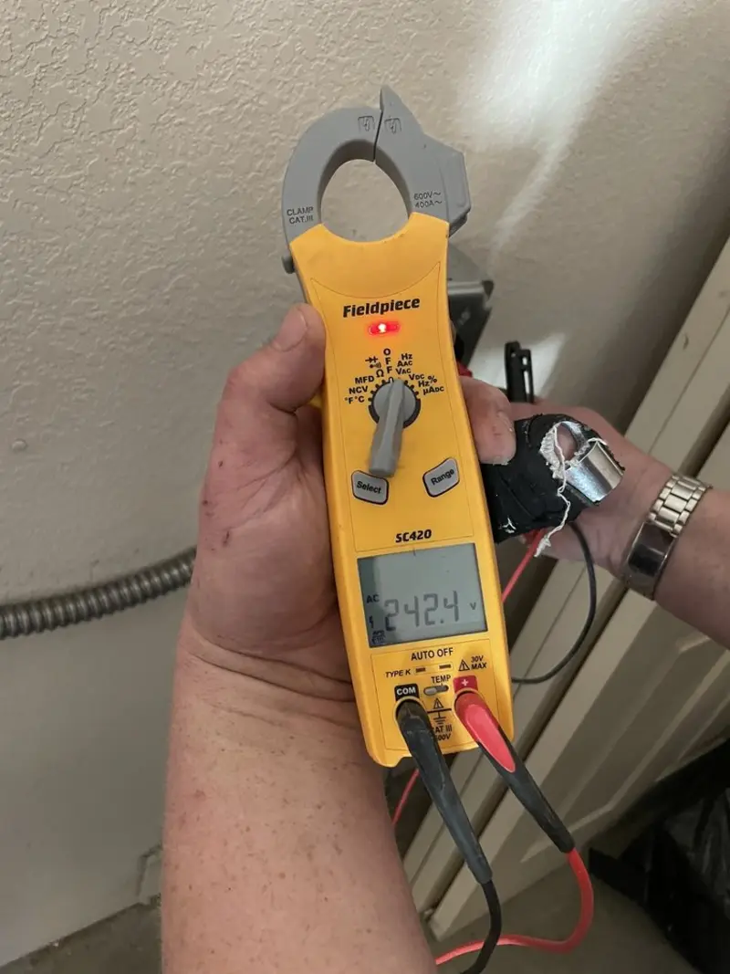 Voltage testing with clamp meter during Electrical Installation Services in Southport